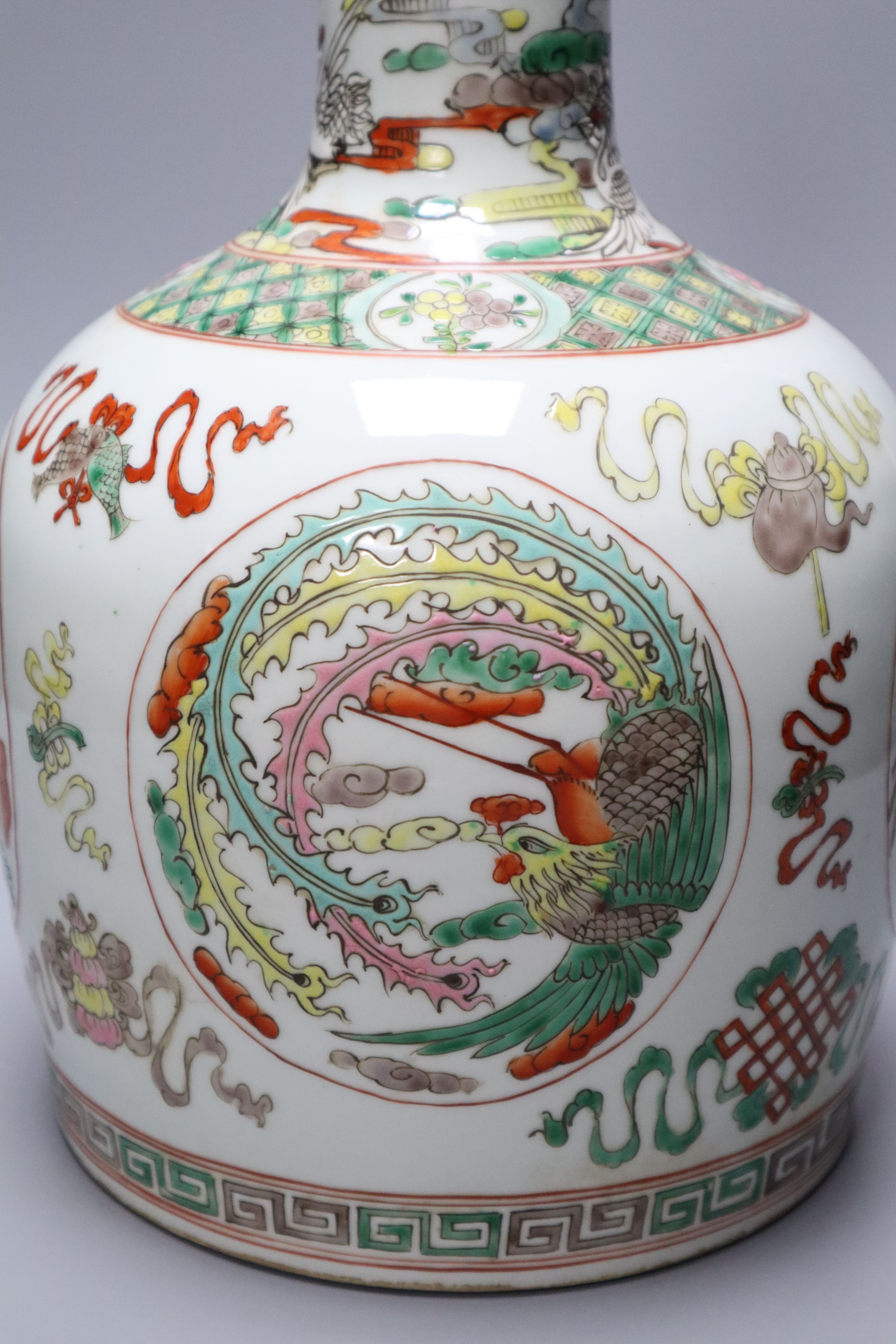 A Chinese famille rose dragon and phoenix bottle vase and cover, 42cm